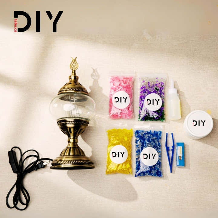 DIY Labs logo with decorative lamp, colored beads in bags, and craft supplies on white surface